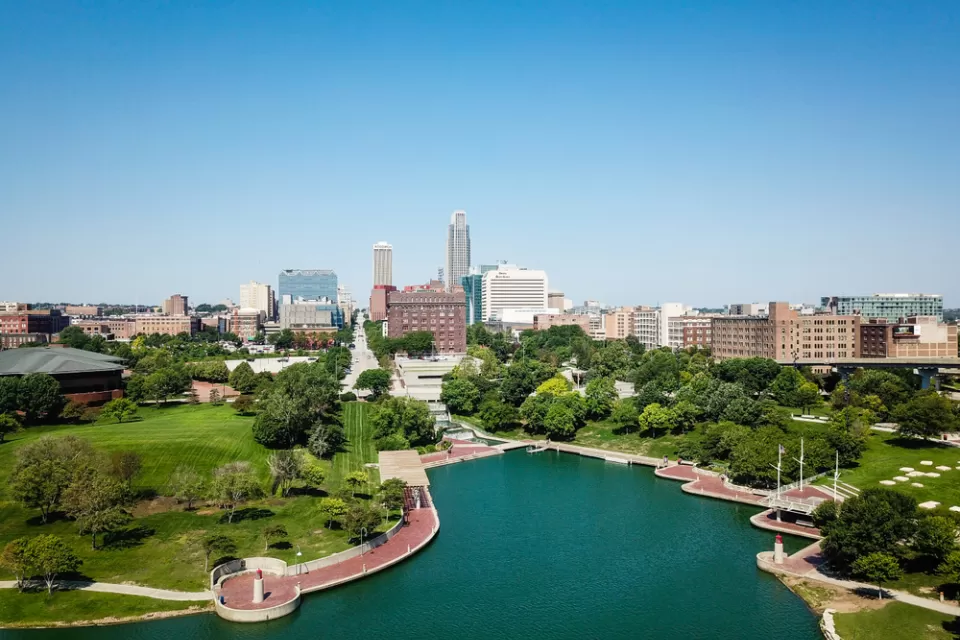 Aerial view of downtown Omaha, Nebraska with lake in foreground